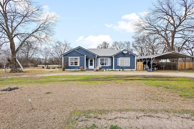 single story home featuring a carport and a front lawn