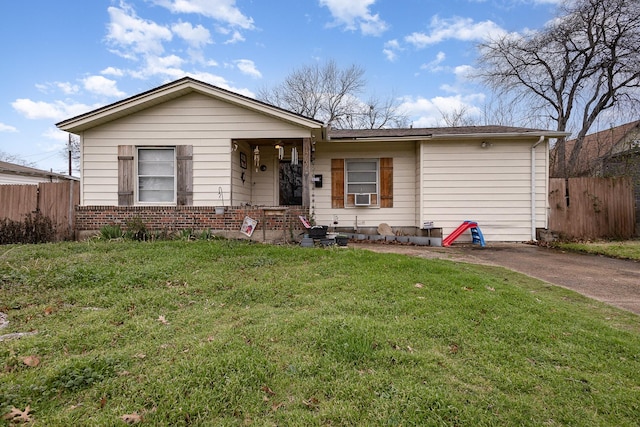 ranch-style house with a front yard and cooling unit