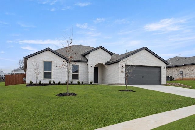 view of front of house featuring a garage, brick siding, fence, concrete driveway, and a front lawn