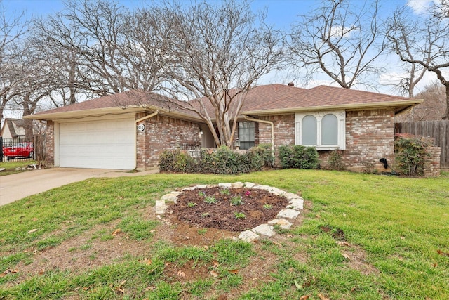 ranch-style house featuring an attached garage, fence, a front lawn, and brick siding