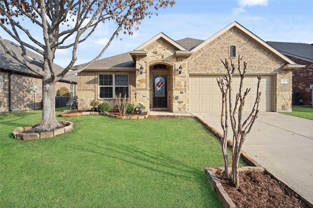 ranch-style home with a garage and a front yard