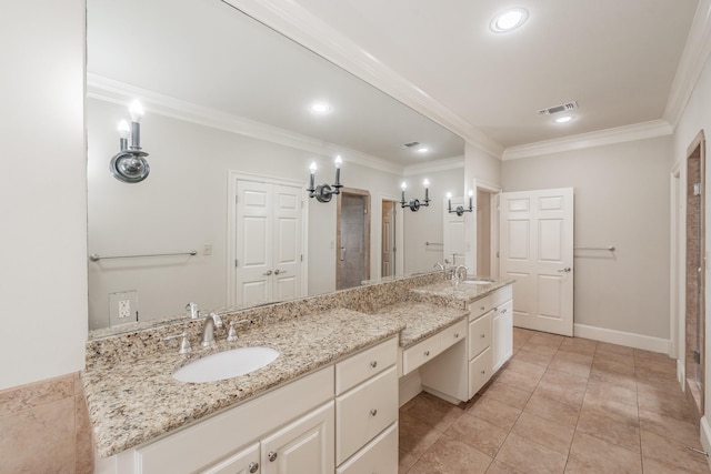 bathroom with crown molding, tile patterned floors, and vanity