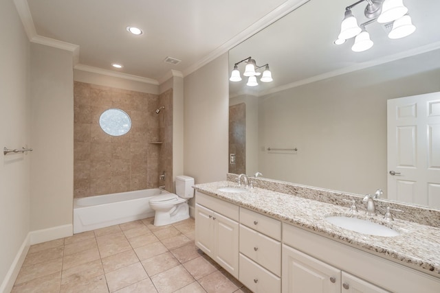 full bathroom with crown molding, vanity, tiled shower / bath, tile patterned floors, and toilet