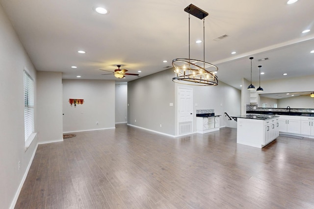 kitchen with ceiling fan, pendant lighting, white cabinets, and dark hardwood / wood-style flooring