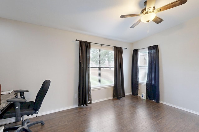 office featuring dark hardwood / wood-style floors and ceiling fan