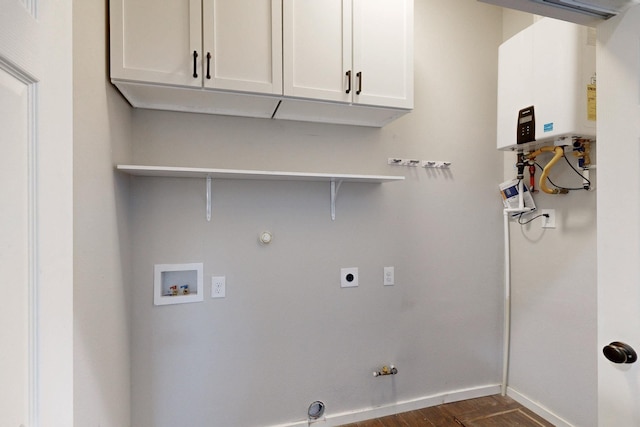 laundry area with gas dryer hookup, cabinets, tankless water heater, and electric dryer hookup