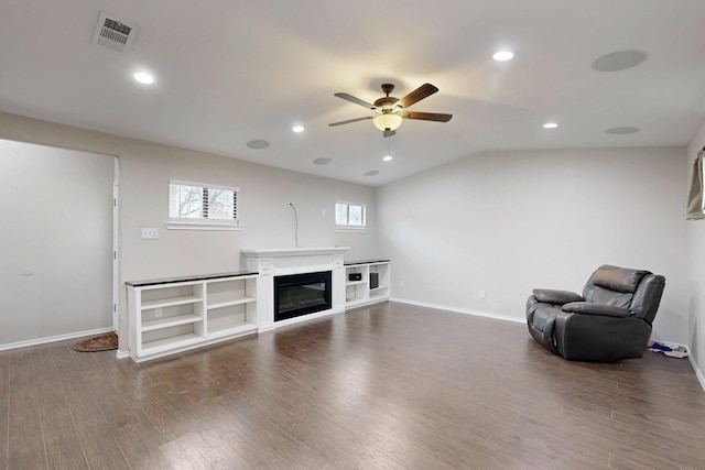 unfurnished room with hardwood / wood-style flooring, vaulted ceiling, and ceiling fan