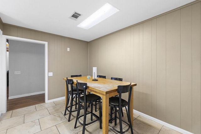 609 S Elm St, Weatherford, TX 76086 - dining area with baseboards and visible vents