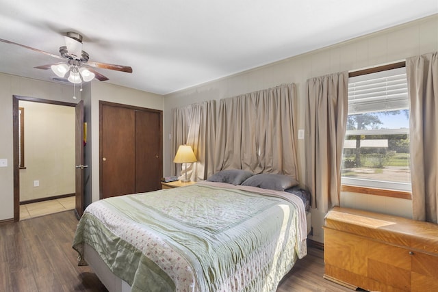609 S Elm St, Weatherford, TX 76086 - bedroom with wood finished floors, a closet, and ceiling fan