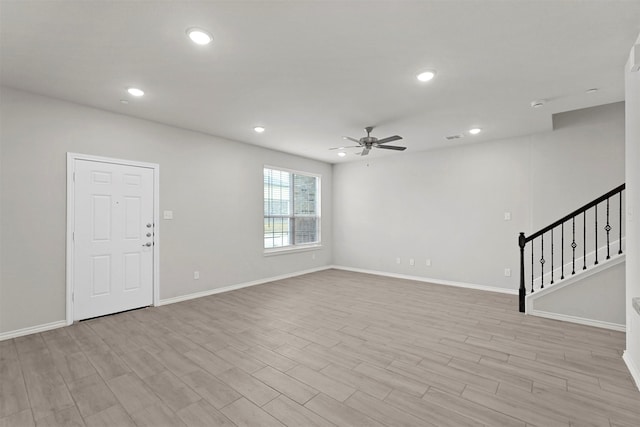 interior space with ceiling fan and light wood-type flooring