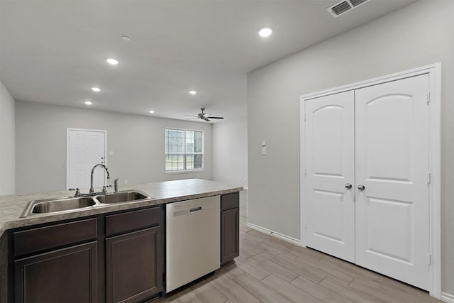 kitchen with dishwasher, sink, ceiling fan, dark brown cabinets, and light wood-type flooring