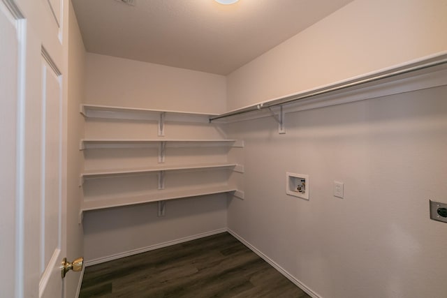 laundry area with dark wood-type flooring, hookup for an electric dryer, and hookup for a washing machine