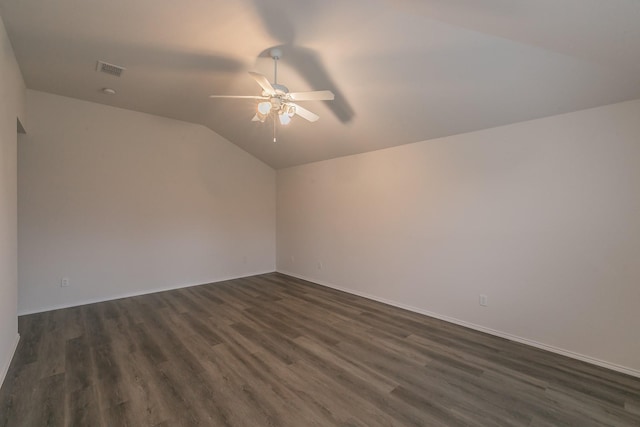 interior space with lofted ceiling, dark hardwood / wood-style floors, and ceiling fan