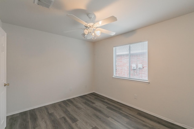 unfurnished room with dark wood-type flooring and ceiling fan