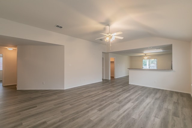 unfurnished living room with wood-type flooring, vaulted ceiling, and ceiling fan