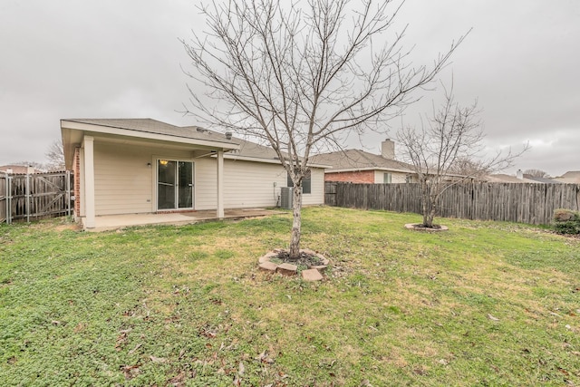 view of yard featuring a patio and central air condition unit