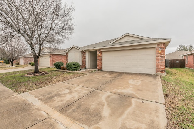 ranch-style home featuring a garage and a front lawn