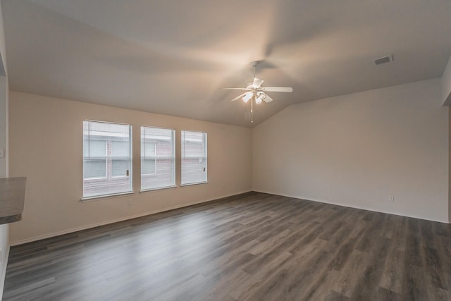 interior space featuring ceiling fan, dark hardwood / wood-style floors, and vaulted ceiling