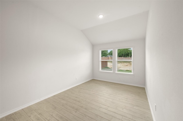 400 Basalt Dr, Azle, TX 76020 - empty room featuring lofted ceiling, light wood-style flooring, and baseboards