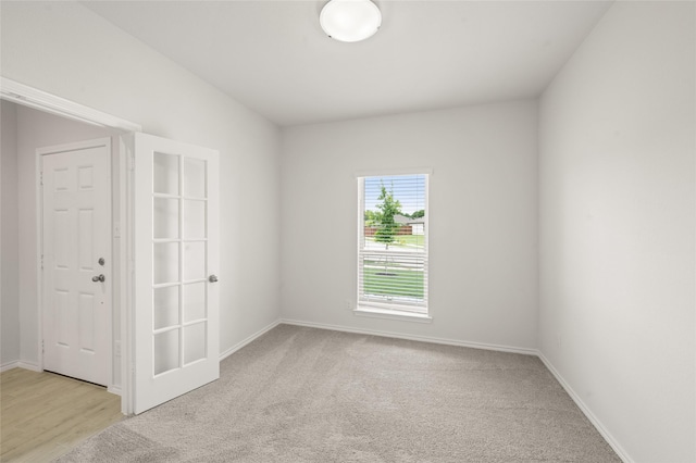 400 Basalt Dr, Azle, TX 76020 - spare room featuring baseboards and light carpet