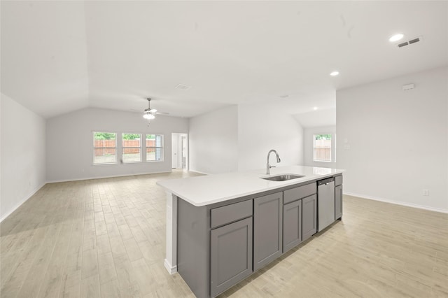 400 Basalt Dr, Azle, TX 76020 - kitchen featuring gray cabinets, a sink, dishwasher, light wood-style floors, and lofted ceiling