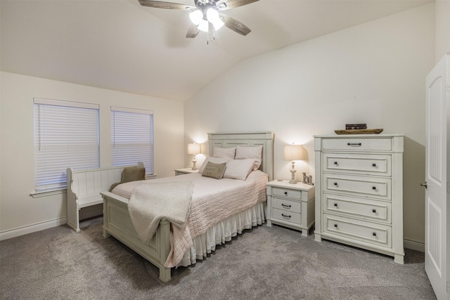 bedroom with vaulted ceiling, light colored carpet, and ceiling fan