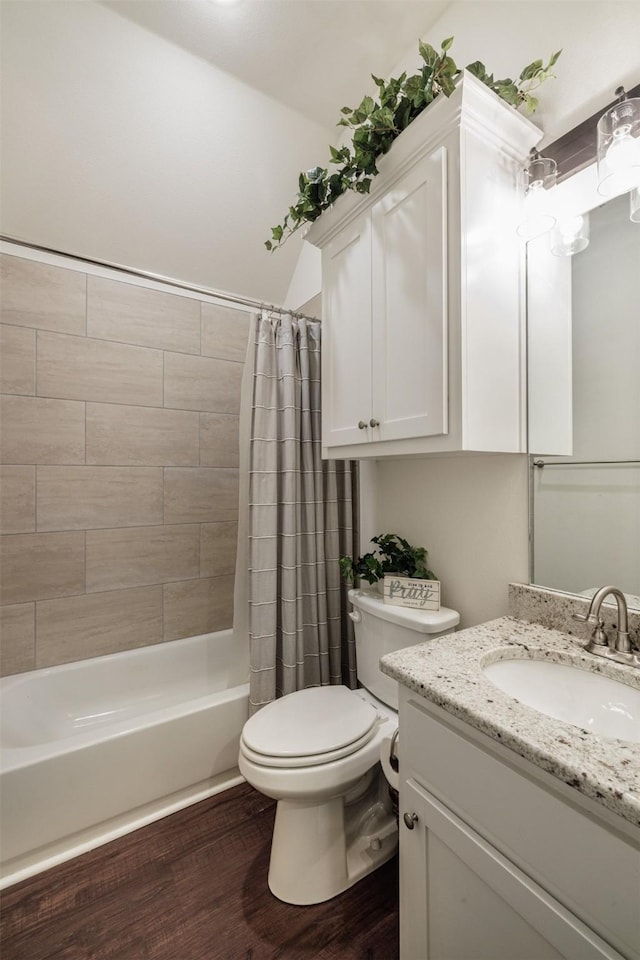 full bathroom with hardwood / wood-style flooring, vanity, toilet, and shower / bath combo with shower curtain