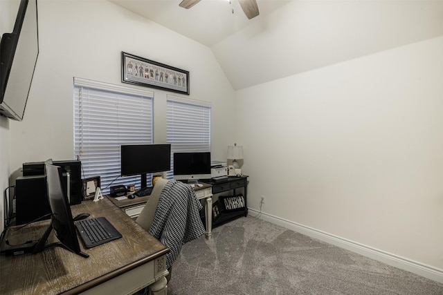 carpeted office with lofted ceiling and ceiling fan