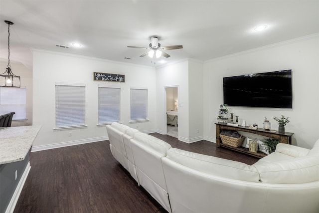 living room featuring ornamental molding, dark hardwood / wood-style floors, and ceiling fan