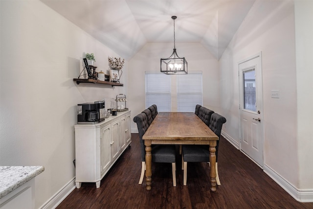 dining area featuring a notable chandelier, vaulted ceiling, and dark hardwood / wood-style floors