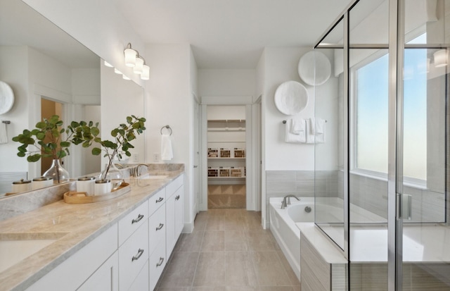 bathroom featuring tile patterned floors, vanity, and independent shower and bath