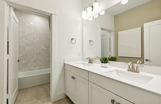 bathroom featuring vanity and tiled shower / bath combo