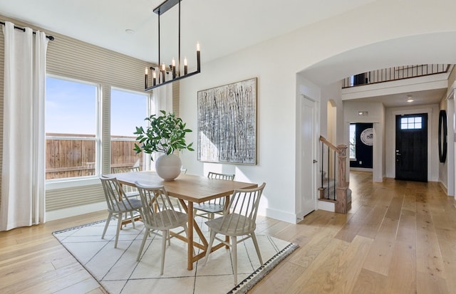 dining room featuring a chandelier and light wood-type flooring