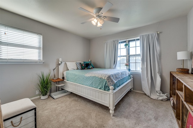 bedroom featuring ceiling fan and light colored carpet