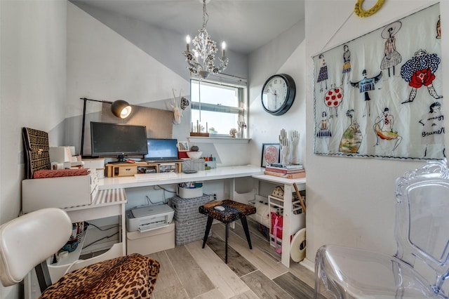 office space featuring a notable chandelier and light wood-type flooring