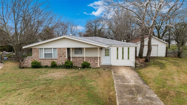 view of front of home with a garage, an outdoor structure, and a front lawn