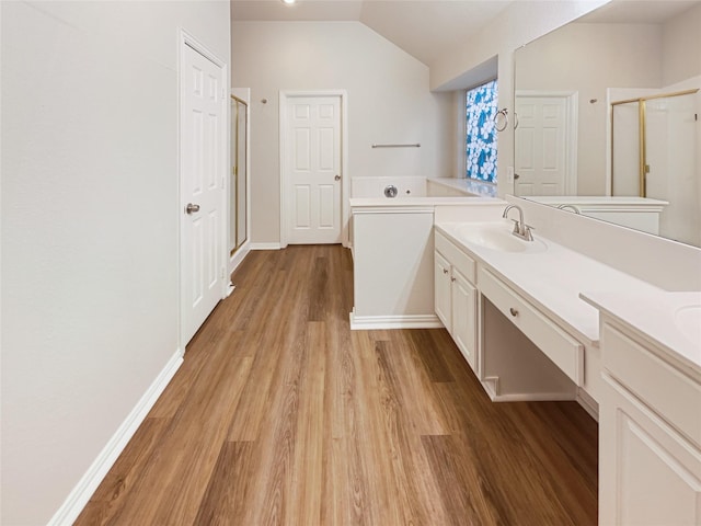 bathroom with lofted ceiling, wood-type flooring, an enclosed shower, and vanity