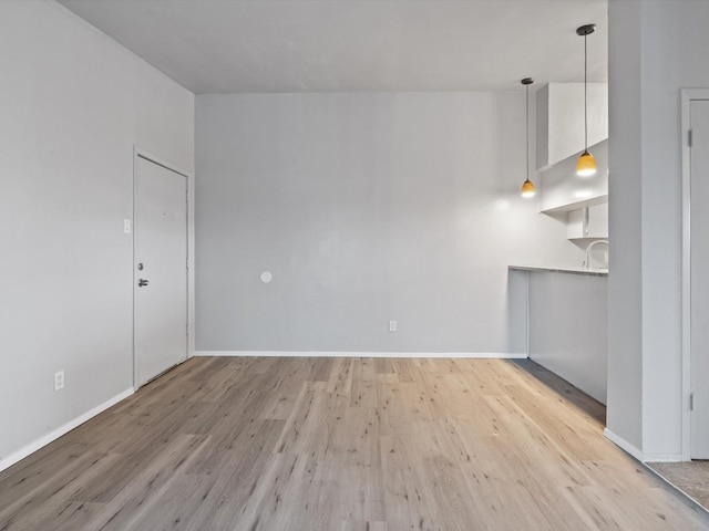 spare room with light wood-type flooring