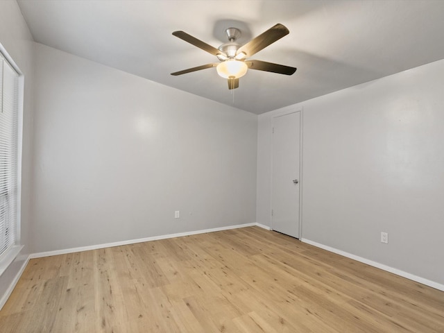 unfurnished room with ceiling fan and light hardwood / wood-style flooring