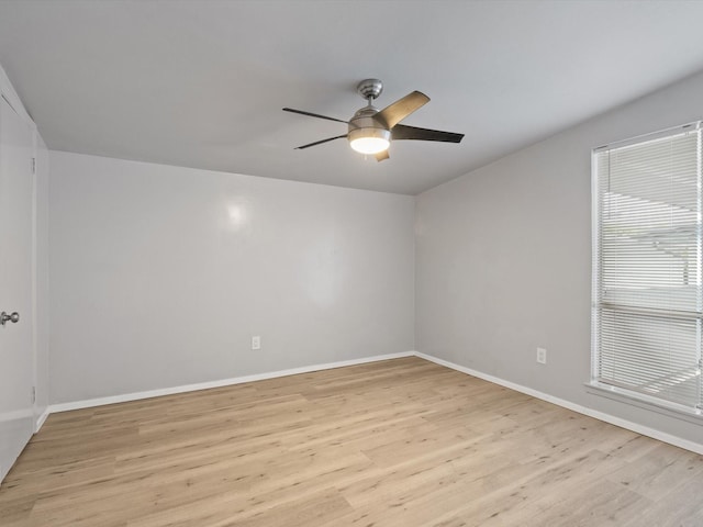 spare room with light hardwood / wood-style flooring and ceiling fan