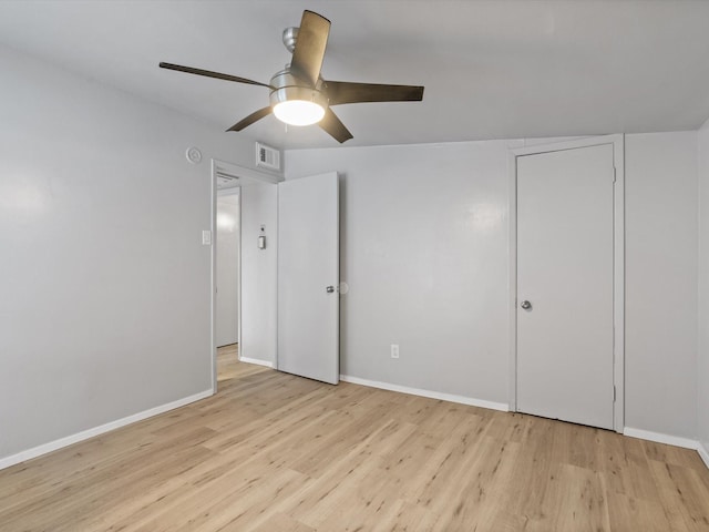 unfurnished bedroom featuring light hardwood / wood-style floors and ceiling fan