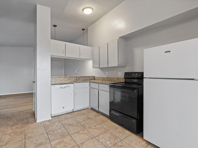 kitchen with sink, hanging light fixtures, light tile patterned floors, white appliances, and white cabinets