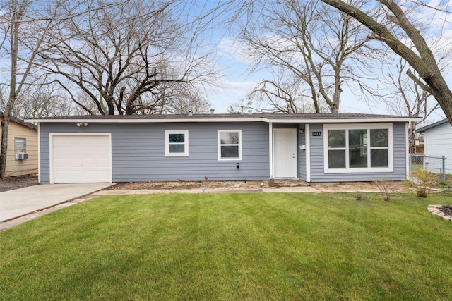 ranch-style home featuring cooling unit, a garage, and a front lawn