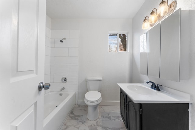 full bathroom with vanity, tiled shower / bath combo, and toilet