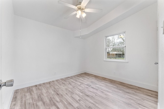 spare room featuring ceiling fan and light hardwood / wood-style flooring