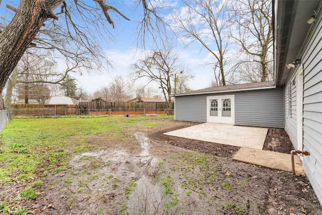 view of yard with a patio area and french doors