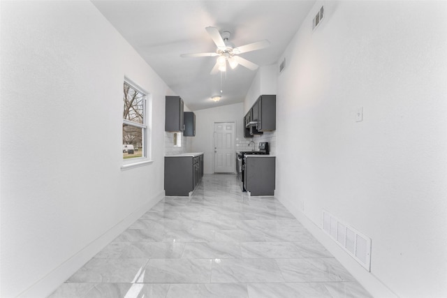 hallway with lofted ceiling