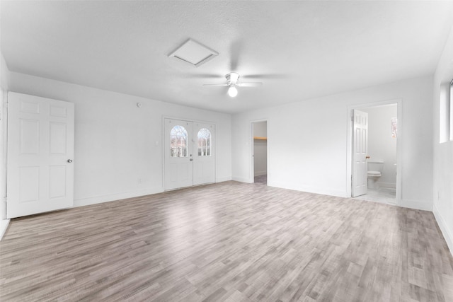 unfurnished room featuring ceiling fan and light hardwood / wood-style flooring