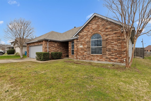 view of front of house featuring a garage and a front yard