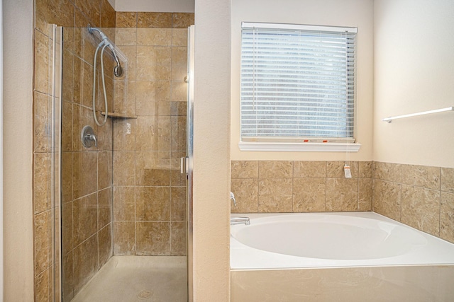 bathroom with separate shower and tub